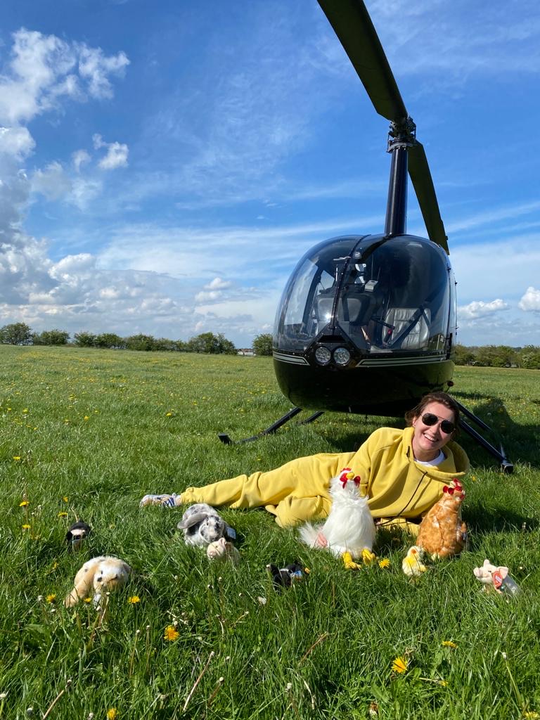Person standing in front of helicopter